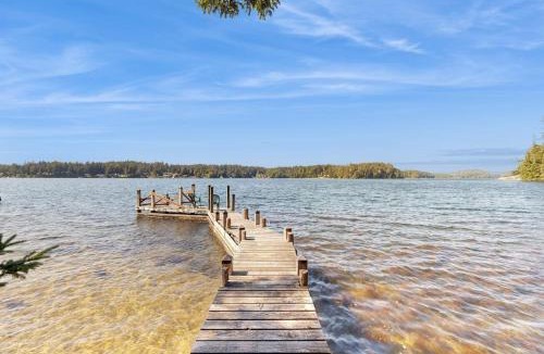 Dunes City House | Unique lakefront cabin near the dunes with a private dock & fireplace