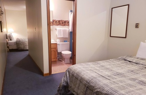 Ironwood Cabin | Unique, Private guestroom inside the Lodge at North Ironwood Acres resort with TWO QUEEN beds and two small bathrooms. DOG FRIENDLY!