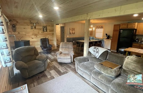 Rapid River House | UP Riverfront Cabin with rustic charm & modern amenities. Great for families!