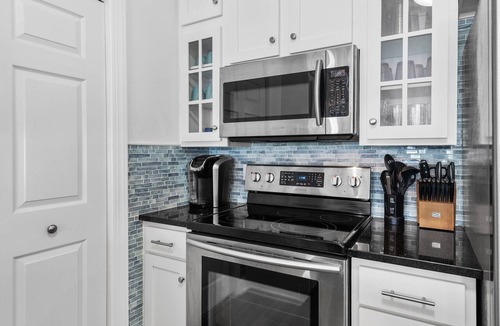 Avalon Beach Estates Condo | Walk to Beach⛱️ Pool + Wrap Around Balcony | Pavilion Palms 103B☀️