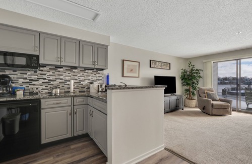 Charlevoix Condo | Waterfront Condo #118C at Edgewater Inn | Pool, Hot Tub, Sauna | Sleeps 4