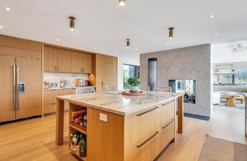 North Sea House | Waterfront Southampton home with dock, pool, gym, great for groups
