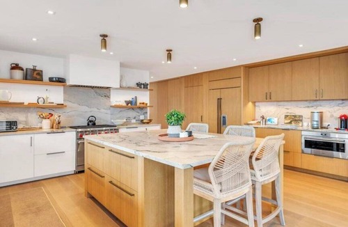 North Sea House | Waterfront Southampton home with dock, pool, gym, great for groups