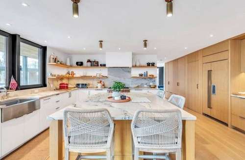 North Sea House | Waterfront Southampton home with dock, pool, gym, great for groups