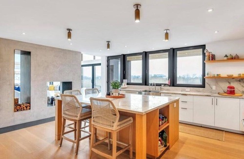 North Sea House | Waterfront Southampton home with dock, pool, gym, great for groups