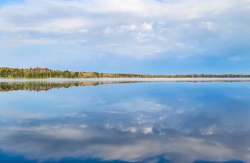 Presque Isle House | Waterfront suite on South Turtle Lake with communal dock, rowboats & firepit