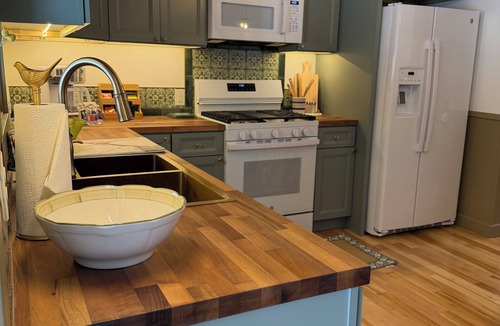 Arcadia House | Welcome to your Up North escape in downtown Arcadia. Newly remodeled with a hot tub and fire pit, just a short walk to Lake Michigan. Enjoy Arcadia Days, July 4th, Golf Crystal Mountain, and day trips to Sleeping Bear Sand Dunes.