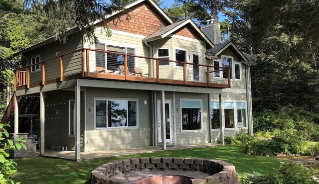 Breathtaking Beachfront Home on Two Acres of Private Forest