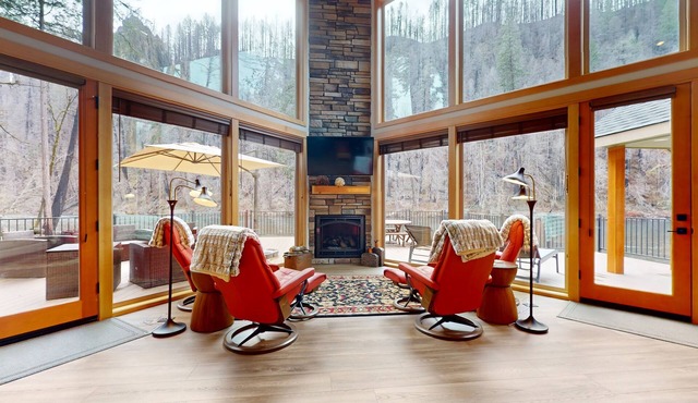 Fully rebuilt riverfront home with deck, fireplace, & W/D - dog-friendly