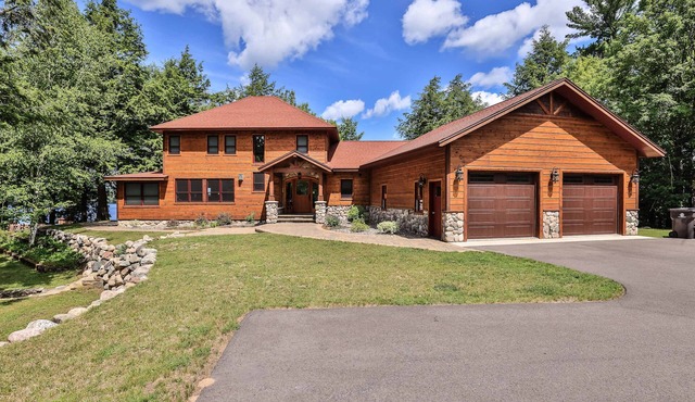 History-filled lakefront home with dock, fire pit, fireplace, & kayaks - dogs OK