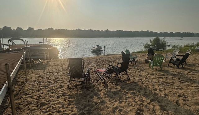Lakeside Sunsets at this 3-bedroom lake cottage that sleeps 12 on Secord Lake.