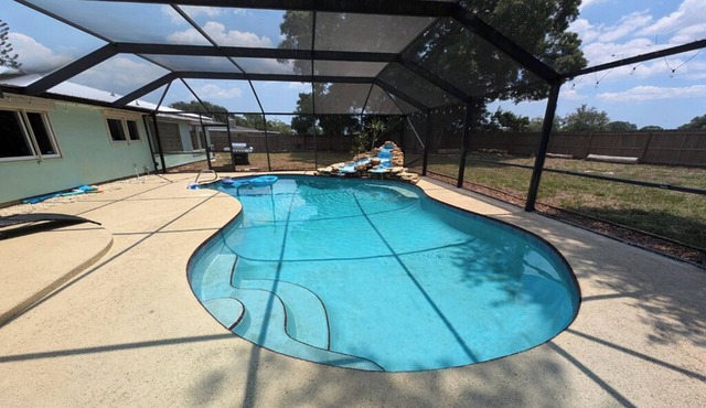 Large 4bd 2bth pool home with hot tub, waterfall feature and private back yard! in Palm Bay