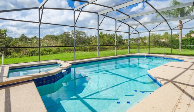 Luxury 5 bed 4 bath SW facing pool with conservation and lake view in Clermont