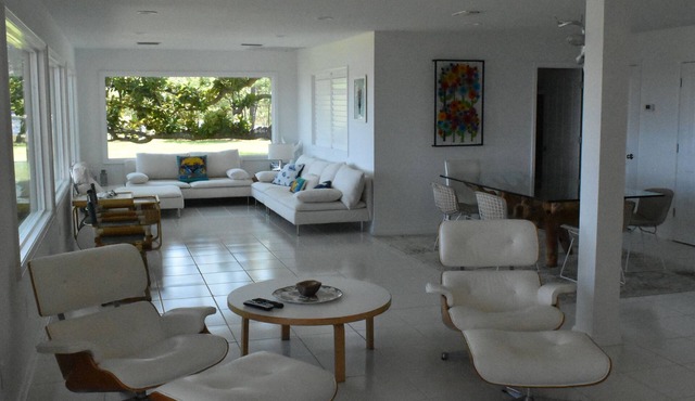 Modern waterfront home on spacious wooded lot. Sleeps 6.