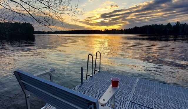 New cabin with lake-facing windows on 400-acre Long Lake of the Phillips Chain.
