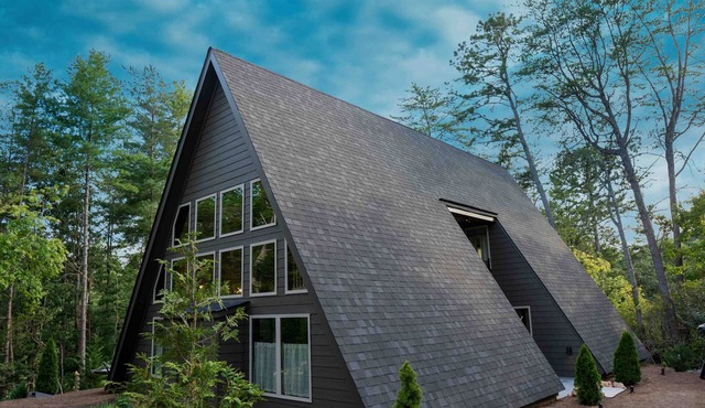 New Upscale Rustic A-frame cabin sitting on golf course