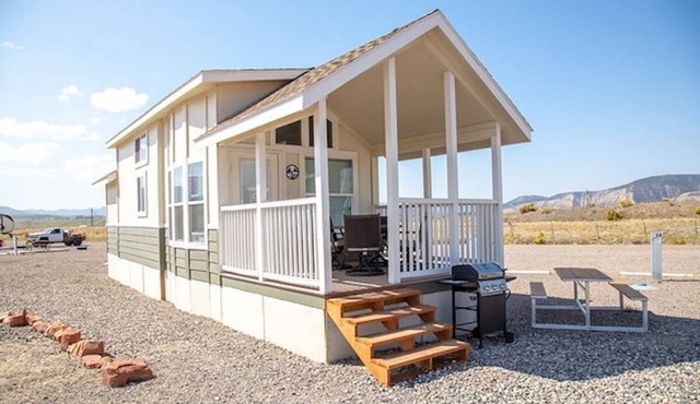 Our largest "not so tiny" tiny home, White River Casita is a beautiful modern tiny home that features a Queen bed on main level, one Queen bed in loft accessible by stairs, one Queen fold out couch with additional sleeping space in loft for sleeping
