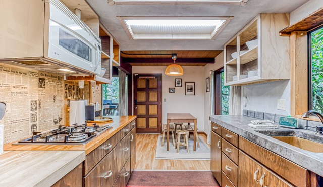 Quiet waterfront cabin on an acre lot with private hot tub & river access