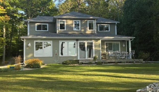Relax on the shores of Green Bay in your beautiful, private, two bedroom home