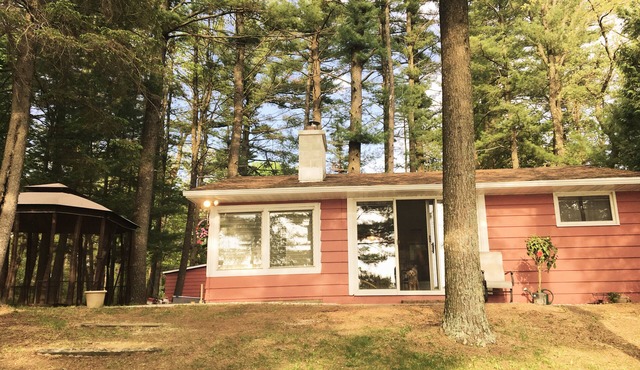 Relaxing Waterfront Cabin Located On A Sandy Bottom Crystal Clear Lake.