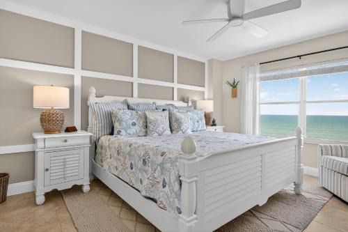 Renovated direct oceanfront corner 2/2 with a large balcony, heated pool, and garage