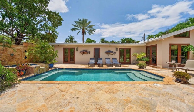 RISE AND SHINE ~ Canal Front 3 BR/3Ba Home w/Heated Pool!