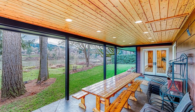 Riverfront all-suite home with amazing views, covered deck, & BBQ