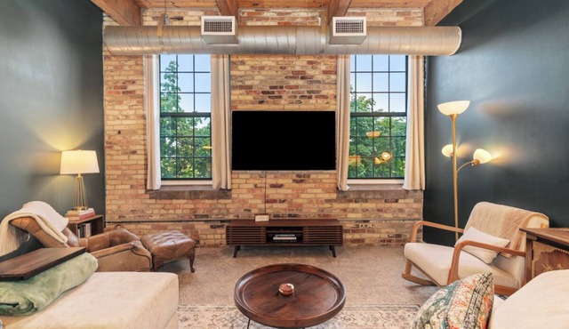 Riverfront Condo for Professionals with Workspace & Prime Medical Mile Access.
