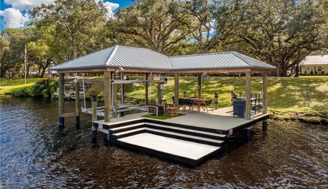 Riverfront Farmhouse on 2 Acres in LaBelle