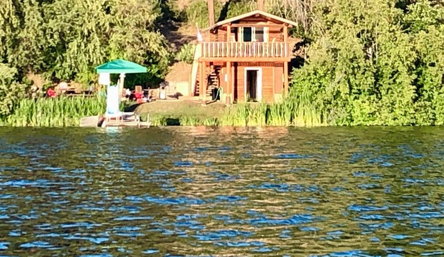 Rustic Ruby Retreat Cozy Cabin on Jump Off Joe Lake w/Dock & Mt. Views-