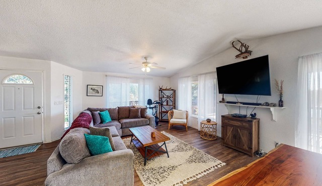Serene waterfront haven with lake views, fenced yard & home office