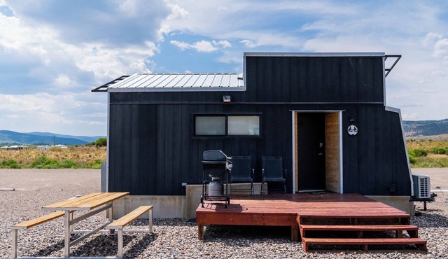 This Tiny Home is custom made by a Colorado craftsman has one Queen bed in loft accessible by stairs and also has a fold out Full futon on main level. Sleeps up to 4. Please note, this home does have a sleeping area in a loft. If you require an accom