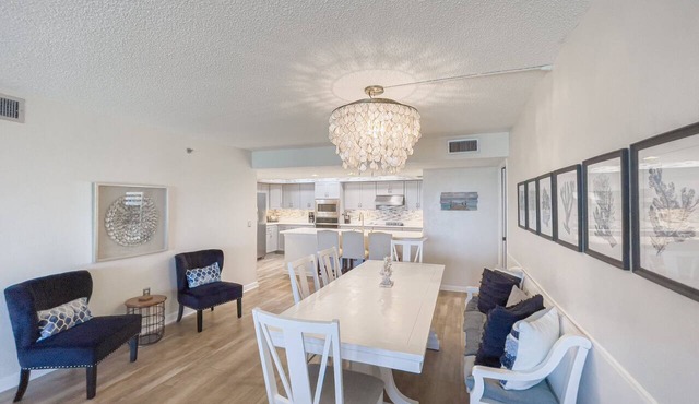 Updated direct oceanfront corner condo with private balcony, heated pool and garage