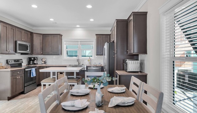 Wake up every day to the sunrise from the deck of this waterfront home 2bed home