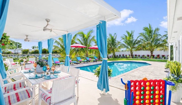 Waterfront Heated Pool Home w/Putting Green, Pergola & Air Hockey in Boynton Beach