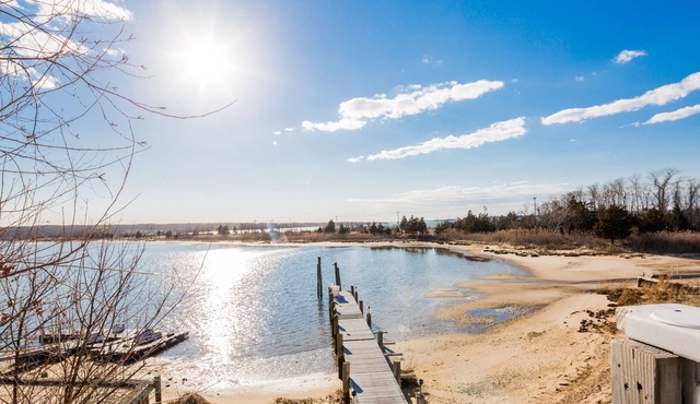 Waterfront on the Bay! A beautiful 5 bedroom home with dock and walk to Beach.